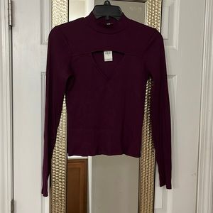 New Long sleeve purple top. Triangle cut out design on chest.